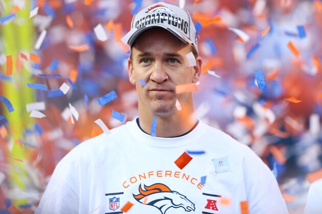 DENVER, CO - JANUARY 19:  Peyton Manning #18 of the Denver Broncos celebrates after they defeated the New England Patriots 26 to 16 during the AFC Championship game at Sports Authority Field at Mile High on January 19, 2014 in Denver, Colorado.  (Photo by Elsa/Getty Images)