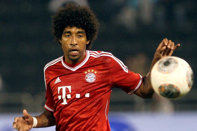 Bayern Munich's player Dante during their friendly football match with Al-Merreikh during  at Al-Saad stadium in Doha on Thursday, Jan. 9, 2014. (AP Photo/Osama Faisal)
