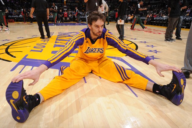 LOS ANGELES, CA - DECEMBER 31: Pau Gasol #16 of the Los Angeles Lakers stretches before a game against the Milwaukee Bucks at STAPLES Center on December 31, 2013 in Los Angeles, California. NOTE TO USER: User expressly acknowledges and agrees that, by downloading and/or using this Photograph, user is consenting to the terms and conditions of the Getty Images License Agreement. Mandatory Copyright Notice: Copyright 2013 NBAE (Photo by Andrew D. Bernstein/NBAE via Getty Images)