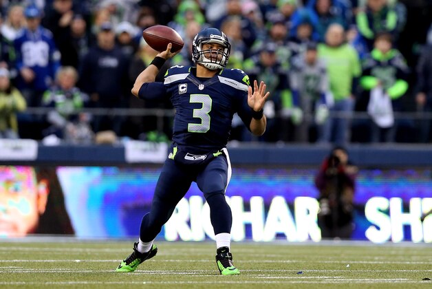 SEATTLE, WA - JANUARY 19: Quarterback Russell Wilson #3 of the Seattle Seahawks throws the ball in the first quarter against the San Francisco 49ers during the 2014 NFC Championship at CenturyLink Field on January 19, 2014 in Seattle, Washington.  (Photo by Christian Petersen/Getty Images)