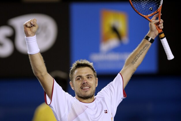 Stanislas Wawrinka of Switzerland celebrates after defeating Novak Djokovic of Serbia in their quarterfinal at the Australian Open tennis championship in Melbourne, Australia, Tuesday, Jan. 21, 2014.(AP Photo/Rick Rycroft)