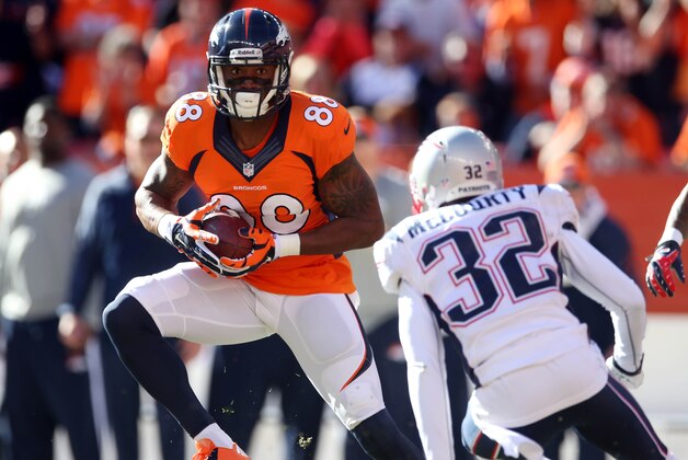 January 19, 2014; Denver, CO, USA; Denver Broncos wide receiver Demaryius Thomas (88) catches a pass against the defense of New England Patriots free safety Devin McCourty (32) in the first half of the 2013 AFC Championship football game at Sports Authority Field at Mile High.  Mandatory Credit: Mark J. Rebilas-USA TODAY Sports