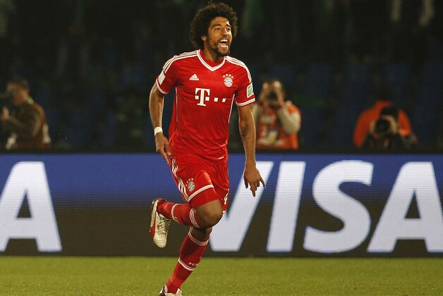 Bayern's Dante celebrates after scoring the opening goal during the final of the soccer Club World Cup  between FC Bayern Munich and Raja Casablanca in Marrakech, Morocco, Saturday, Dec. 21, 2013. (AP Photo/Christophe Ena)