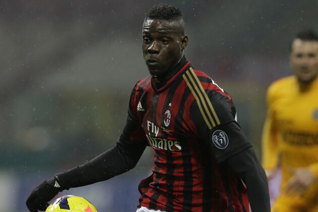 AC Milan forward Mario Balotelli controls the ball during a Serie A soccer match between AC Milan and Hellas verona, at the San Siro stadium in Milan, Italy, Sunday, Jan.19, 2014. (AP Photo/Luca Bruno)
