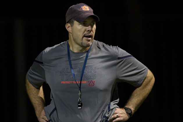 Auburn offensive line coach Jeff Grimes is pictured during the first day of fall practice for the Auburn Tigers in Auburn, Ala., Wednesday, Aug. 3, 2011. (AP Photo/Dave Martin)
