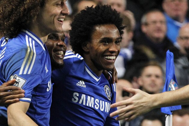 Chelsea's Samuel Eto'o. 2nd left, celebrates with David Luiz, left, and Willian after scoring his 3rd goal against Manchester United's during their English Premier League soccer match at Stamford Bridge, London, Sunday, Jan. 19, 2014. (AP Photo/Sang Tan)