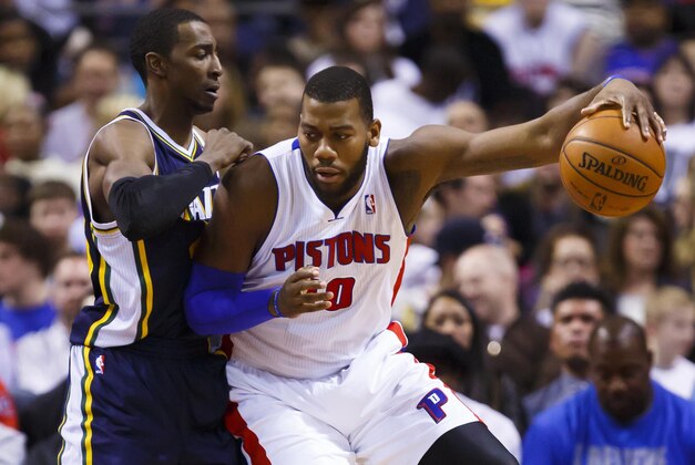 Jan 17, 2014; Auburn Hills, MI, USA; Detroit Pistons power forward Greg Monroe (10) is defended by Utah Jazz small forward Jeremy Evans (40) in the first half at The Palace of Auburn Hills. Utah won 110-89. Mandatory Credit: Rick Osentoski-USA TODAY Sports