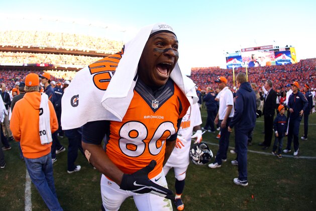 DENVER, CO - JANUARY 19:  Julius Thomas #80 of the Denver Broncos celebrates their 26 to 16 win over the New England Patriots during the AFC Championship game at Sports Authority Field at Mile High on January 19, 2014 in Denver, Colorado.  (Photo by Justin Edmonds/Getty Images)