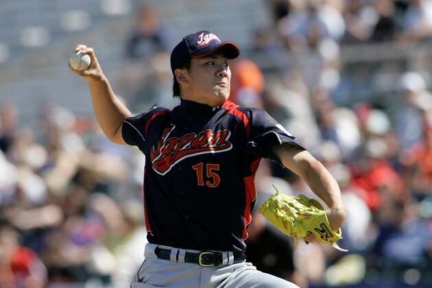 Japan's Masahiro Tanaka pitches to the San Francisco Giants in an exhibition spring baseball game in Scottsdale, Ariz., Wednesday, March 11, 2009. (AP Photo/Jeff Chiu)