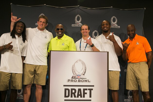 Jamaal Charles, (L-R) running back for the Kansas City Chiefs, J.J. Watt, defensive end for the Houston Texans, Hall of  Famer Deion Sanders, Drew Brees, quarterback for the New Orleans Saints, Robert Quinn, defensive end for the St. Louis Rams, and Jerry Rice, Pro Football Hall of Famer, flash Hawaiian shakes during a news conference for the NFL Pro Bowl Draft, Tuesday, Jan. 21, 2014, Kapolei, Hawaii. (AP Photo/Marco Garcia)
