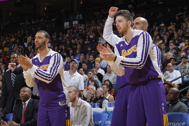 OAKLAND, CA - DECEMBER 21: Los Angeles Lakers players on the bench celebrate a good play against the Golden State Warriors on December 21, 2013 at Oracle Arena in Oakland, California. NOTE TO USER: User expressly acknowledges and agrees that, by downloading and or using this photograph, user is consenting to the terms and conditions of Getty Images License Agreement. Mandatory Copyright Notice: Copyright 2013 NBAE (Photo by Rocky Widner/NBAE via Getty Images)