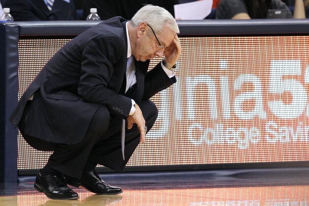 Jan 20, 2014; Charlottesville, VA, USA; North Carolina Tar Heels head coach Roy Williams reacts on the sidelines against the Virginia Cavaliers in the second half at John Paul Jones Arena. The Cavaliers won 76-61. Mandatory Credit: Geoff Burke-USA TODAY Sports