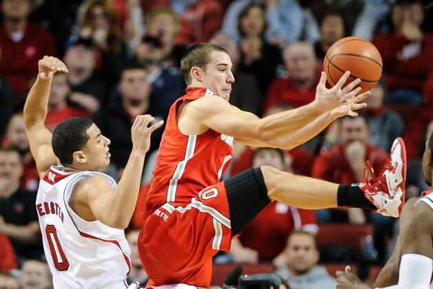 LINCOLN, NE - JANUARY 20:  Aaron Craft #4 of the Ohio State Buckeyes grabs a rebound over Tai Webster #0 of the Nebraska Cornhuskers during a game at Pinnacle Bank Arena on January 20, 2014 in Lincoln, Nebraska. (Photo by Eric Francis/Getty Images)