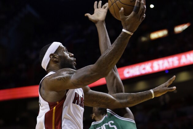 Miami Heat small forward LeBron James, left, goes to the basket against Boston Celtics' Jeff Green (8) during the first quarter of an NBA basketball game in Miami, Tuesday, Jan. 21, 2014. (AP PhotoAlan Diaz) Miami Heat small forward LeBron James, left, goes to the basket against Boston Celtics' Jeff Green (8) during the first quarter of an NBA basketball game in Miami, Tuesday, Jan. 21, 2014. (AP PhotoAlan Diaz)