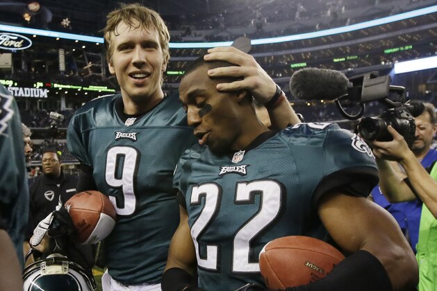 Philadelphia Eagles quarterback Nick Foles (9) and cornerback Brandon Boykin (22) leave the field after an NFL football game against the Dallas Cowboys, Sunday, Dec. 29, 2013, in Arlington, Texas. The Eagles won 24-22. (AP Photo/Tony Gutierrez)