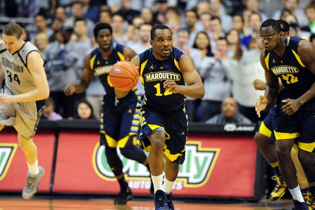 Jan 20, 2014; Washington, DC, USA; Marquette Golden Eagles guard Derrick Wilson (12) dribbles the ball in the first half against the Georgetown Hoyas at Verizon Center. Mandatory Credit: Evan Habeeb-USA TODAY Sports