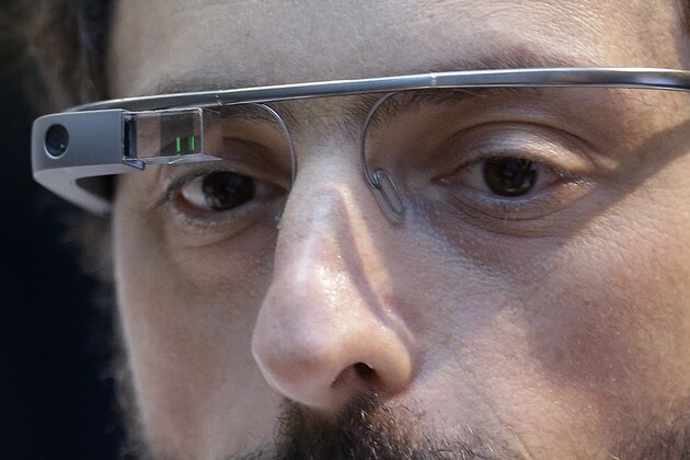 Google co-rounder Sergey Brin wears Google Glass glasses at an announcement for the Breakthrough Prize in Life Sciences at Genentech Hall on UCSF’s Mission Bay campus in San Francisco, Wednesday, Feb. 20, 2013. Google is giving more people a chance to pay $1,500 for a pair of the Internet-connected glasses that the company is touting as the next breakthrough in mobile computing. The product, dubbed
