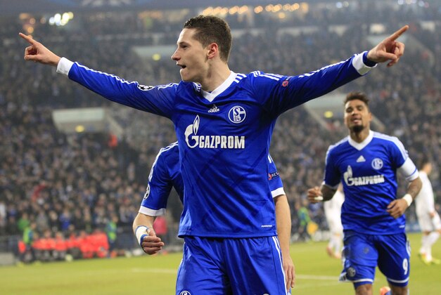 Schalke's Julian Draxler celebrates after scoring his side's opening goal during the Champions League group E soccer match between FC Schalke 04 and FC Basel in Gelsenkirchen, Germany, Wednesday, Dec.11,2013. (AP Photo/Frank Augstein)