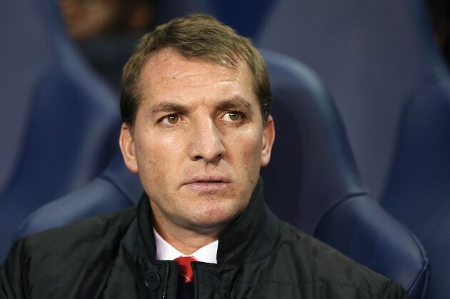 Liverpool's manager Brendan Rodgers sits in the technical area prior to kick off for their English Premier League soccer match between Tottenham Hotspur and Liverpool at the White Hart Lane stadium in London, Sunday, Dec.15, 2013. (AP Photo/Alastair Grant)