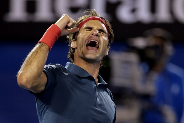 Roger Federer of Switzerland celebrates after defeating Andy Murray of Britain during their quarterfinal at the Australian Open tennis championship in Melbourne, Australia, Wednesday, Jan. 22, 2014.(AP Photo/Rick Rycroft)