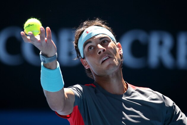 MELBOURNE, AUSTRALIA - JANUARY 22:  Grigor Dimitrov of Bulgaria serves in his quarterfinal match against Rafael Nadal of Spain during day 10 of the 2014 Australian Open at Melbourne Park on January 22, 2014 in Melbourne, Australia.  (Photo by Michael Dodge/Getty Images)