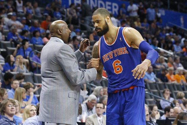 New York Knicks head coach Mike Woodson greets center Tyson Chandler (6) as he comes out of the game against the Oklahoma City Thunder in the fourth quarter of an NBA basketball game in Oklahoma City, Sunday, April 7, 2013. New York won 125-120. (AP Photo/Sue Ogrocki)