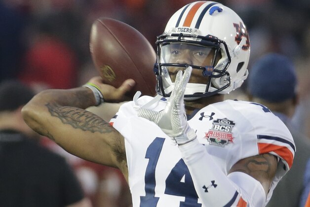 Auburn quarterback Nick Marshall warms up before the NCAA BCS National Championship college football game against Florida State Monday, Jan. 6, 2014, in Pasadena, Calif. (AP Photo/Chris Carlson)