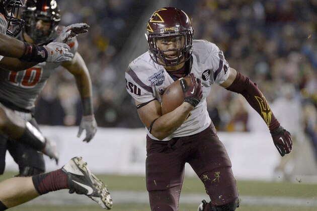 SAN DIEGO, CA - DECEMBER 30:  DJ Foster #8 of the Arizona State Sun Devils runs the ball against the Texas Tech Red Raiders during their National University Holiday Bowl Game on December 30, 2013 at Qualcomm Stadium in San Diego, California. (Photo by Donald Miralle/Getty Images)