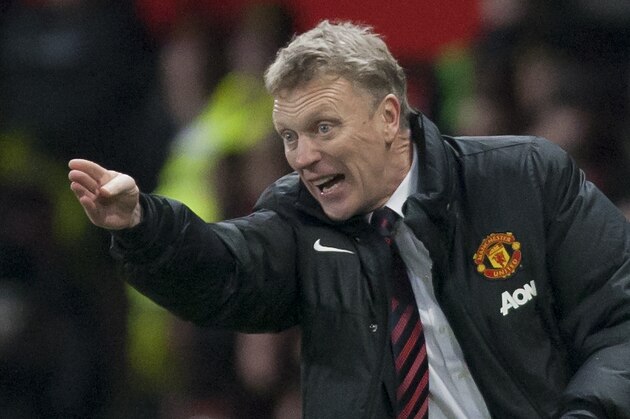 Manchester United's manager David Moyes directs proceedings during his team's 2-0 win against Swansea City in their English Premier League soccer match at Old Trafford Stadium, Manchester, England, Saturday Jan. 11, 2014. (AP Photo/Jon Super)