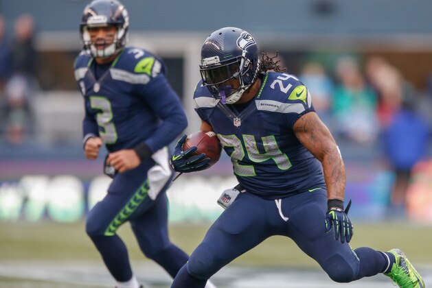 SEATTLE, WA - DECEMBER 29:  Running back Marshawn Lynch #24 of the Seattle Seahawks rushes against the St. Louis Rams at CenturyLink Field on December 29, 2013 in Seattle, Washington.  (Photo by Otto Greule Jr/Getty Images)
