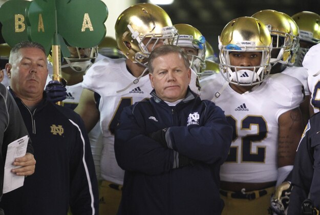 Nov 9, 2013; Pittsburgh, PA, USA; Notre Dame head coach Brian Kelly (center) waits to lead the Fighting Irish onto the field to play the Pittsburgh Panthers during the first quarter at Heinz Field. PITT won 28-21. Mandatory Credit: Charles LeClaire-USA TODAY Sports
