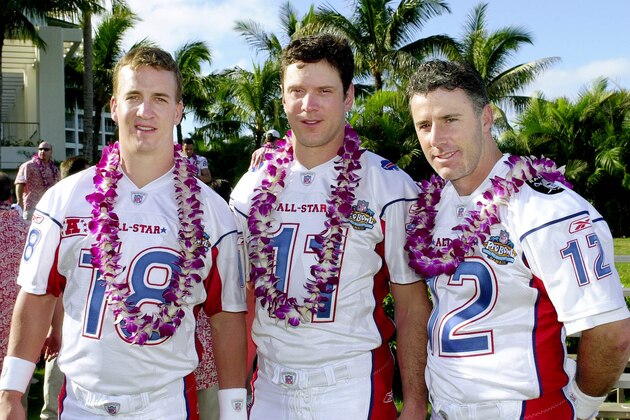 AFC Pro Bowl quarterbacks, from left, Peyton Manning of the Colts, Drew Bledsoe of the  Buffalo Bills and Rich Gannon of the Oakland Raiders, pose for a group photo at the American Football Conference practice for the Pro Bowl at the Ko Olina resort in Kapolei on Oahu in Hawaii Friday, Jan. 31, 2003. The AFC meets the NFC in the Pro Bowl Sunday, Feb. 2.  (AP Photo/Reed Saxon)