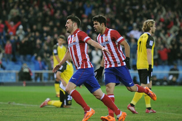 MADRID, SPAIN - JANUARY 19: David Villa (L) of Club Atletico de Madrid celebrates beside Diego Costa after scoring Atletico's 1st goal during the La Liga match between Club Atletico de Madrid and Sevilla FC at Vicente Calderon Stadium on January 19, 2014 in Madrid, Spain.  (Photo by Denis Doyle/Getty Images)