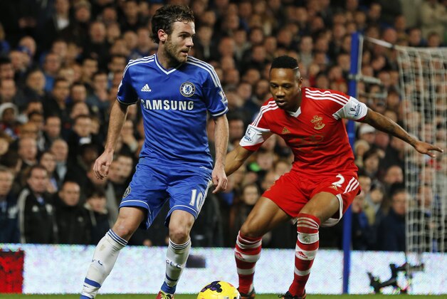 Chelsea's Juan Mata, left, of Spain, controls the ball in front of Southampton's Nathaniel Clyne during their English Premier League soccer match at the Stamford bridge ground in London, Sunday Dec. 1, 2013. Chelsea won the match 3-1. (AP Photo/Lefteris Pitarakis)