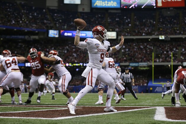 Oklahoma quarterback Trevor Knight (9) passes from his own end zone after the NCAA college football Sugar Bowl against Alabama in New Orleans, Thursday, Jan. 2, 2014. Oklahoma won 45-31. (AP Photo/Patrick Semansky) Oklahoma quarterback Trevor Knight (9) passes from his own end zone after the NCAA college football Sugar Bowl against Alabama in New Orleans, Thursday, Jan. 2, 2014. Oklahoma won 45-31. (AP Photo/Patrick Semansky)
