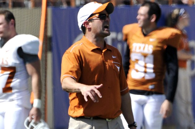 Texas defensive coordinator Manny Diaz shouts to his players at the Orange and White spring NCAA college football game, Sunday, April 1, 2012, in Austin, Texas. (AP Photo/Michael Thomas)