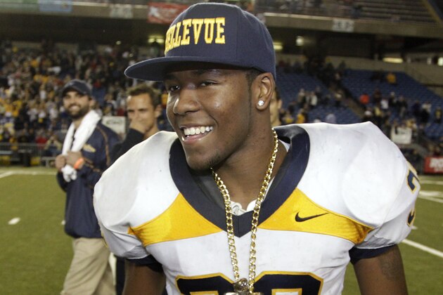 Bellevue's Budda Baker celebrates on the field after Bellevue beat Eastside Catholic, 35-3 to win the 3A division high school state championship football game, for the fifth time in a row, Friday, Nov. 30, 2012, in Tacoma, Wash. (AP Photo/Ted S. Warren)