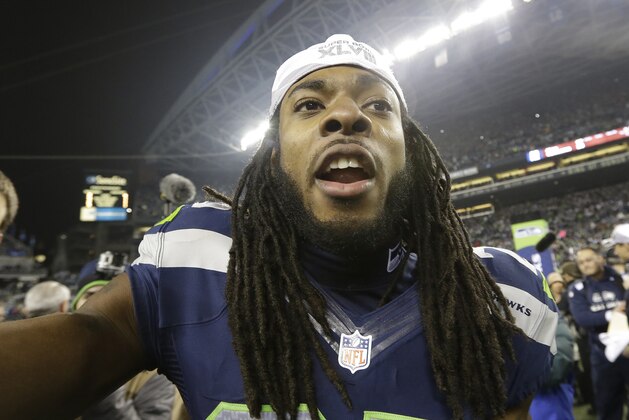Richard Sherman de los Seahawks de Seattle celebra luego de la victoria en la final de la Conferencia Nacional ante los 49ers de San Francisco el domingo 19 de enero 2014. (AP Foto/Elaine Thompson)