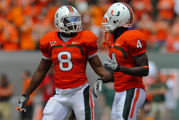 Sept 29, 2012; Miami, FL, USA; Miami Hurricanes running back Duke Johnson (left) talks with wide receiver Phillip Dorsett (right) during a game against the North Carolina State Wolfpack at Sun Life Stadium. Miami won 44-37. Mandatory Credit: Steve Mitchell-USA TODAY Sports