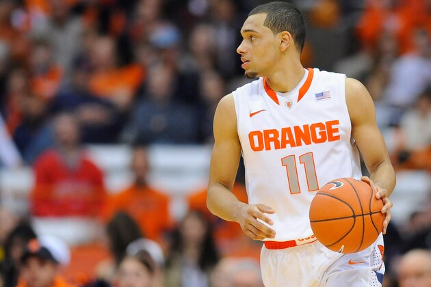 SYRACUSE, NY - DECEMBER 03:  Tyler Ennis #11 of the Syracuse Orange controls the ball against the Indiana Hoosiers during the second half at the Carrier Dome on December 3, 2013 in Syracuse, New York.  Syracuse defeated Indiana 69-52.  (Photo by Rich Barnes/Getty Images)