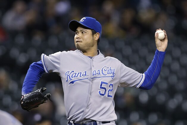 Kansas City Royals starting pitcher Bruce Chen throws to a Seattle Mariners batter in the first inning of a baseball game Tuesday, Sept. 24, 2013, in Seattle. (AP Photo/Elaine Thompson)