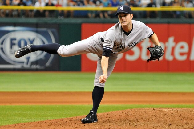 ST. PETERSBURG, FL - AUGUST 25: Pitcher David Robertson #30 of the New York Yankees throws in relief against the Tampa Bay Rays bats August 25, 2013 at Tropicana Field in St. Petersburg, Florida. The Yankees won 3 - 2. (Photo by Al Messerschmidt/Getty Images)