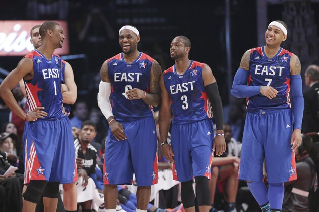 From left, East Team's Chris Bosh of the Miami Heat, LeBron James of the Miami Heat, Dwyane Wade of the Miami Heat and Carmelo Anthony of the New York Knicks share a moment during the first half of the NBA All-Star basketball game against the West Team Sunday, Feb. 17, 2013, in Houston. (AP Photo/Eric Gay)