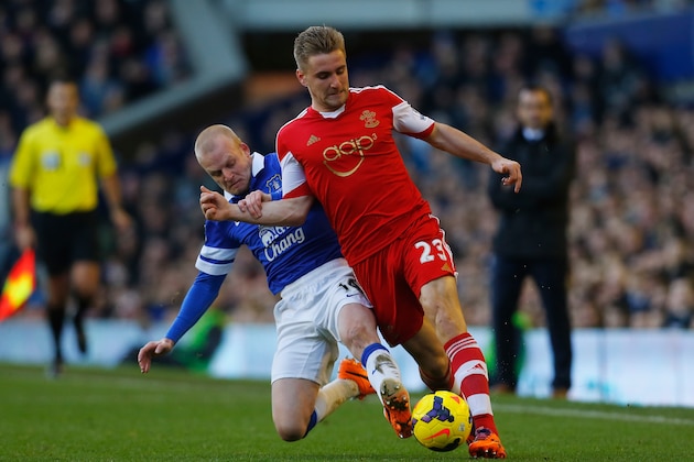LIVERPOOL, ENGLAND - DECEMBER 29:  Luke Shaw of Southampton is tackled by Steven Naismith of Everton during the Barclays Premier League match between Everton and Southampton at Goodison Park on December 29, 2013 in Liverpool, England.  (Photo by Paul Thomas/Getty Images)