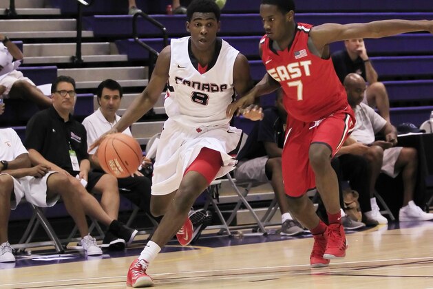 Jul 18, 2013; Washington, DC, USA; Team Canadaplayer Mantaque Caesar-Gill (8) dribbles the ball against Team USA East player Khadeen Carrington (7) during the Nike Global Challenge at Trinity University. Mandatory Credit: Geoff Burke-USA TODAY Sports