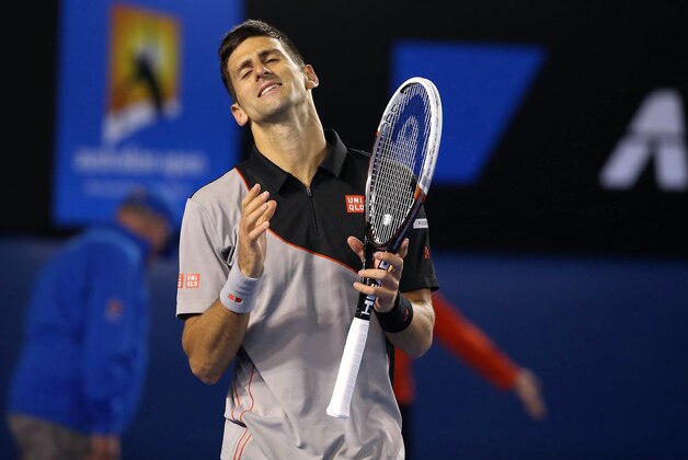 Jan 21, 2014; Melbourne, AUSTRALIA; Novak Djokovic (SRB) reacts during his match against Stanislas Wawrinka (SUI) on day nine of the 2014 Australian Open at Melbourne Park. Mandatory Credit: Nicolas Luttiau/Presse Sports via USA TODAY Sports Jan 21, 2014; Melbourne, AUSTRALIA; Novak Djokovic (SRB) reacts during his match against Stanislas Wawrinka (SUI) on day nine of the 2014 Australian Open at Melbourne Park. Mandatory Credit: Nicolas Luttiau/Presse Sports via USA TODAY Sports