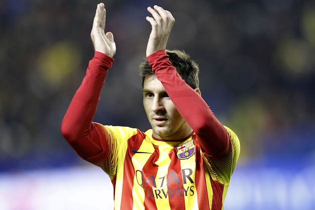 Barcelona's  Lionel Messi from Argentina claps his hands  during their la Copa del Rey soccer match against Levante at the Ciutat de Valencia stadium in Valencia, Spain, Wednesday Jan. 22, 2014. The Argentinean plays his 400th game in an Barcelona shirt in the Copa del Rey against Levante.(AP Photo/Alberto Saiz)