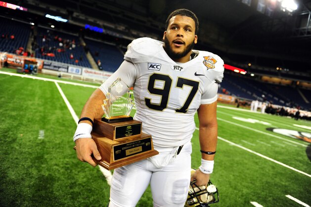 Dec 26, 2013; Detroit, MI, USA; Pittsburgh Panthers defensive lineman Aaron Donald (97) holds the lineman of the game trophy after defeating Bowling Green Falcons 30-27 to win the Little Caesars Pizza Bowl at Ford Field. Mandatory Credit: Andrew Weber-USA TODAY Sports