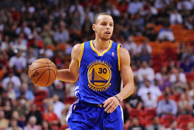 Dec 12, 2012; Miami, FL, USA; Golden State Warriors point guard Stephen Curry (30) dribbles during a game against the Miami Heat at American Airlines Arena. Mandatory Credit: Steve Mitchell-USA TODAY Sports