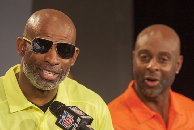 Pro Football Hall of Famer Jerry Rice, right, heckles Hall of Famer Deion Sanders during a news conference for the NFLPro Bowl Draft, Tuesday, Jan. 21, 2014, Kapolei, Hawaii.  (AP Photo/Marco Garcia)